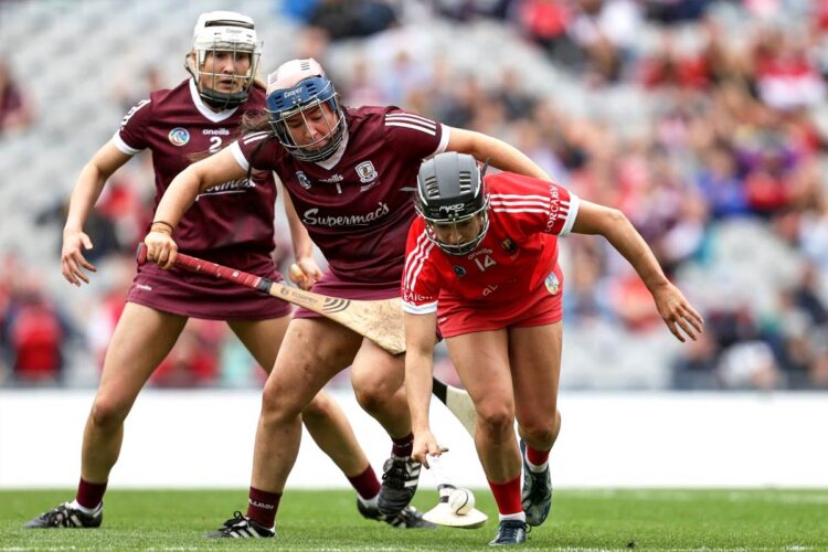 Cork's Amy O’Connor and Galway goalkeeper Sarah Healy. Photo: INPHO/Laszlo Geczo