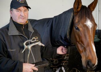 Paul Hennessy with Heaven Help Us and his HRI National Hunt Achievement Award