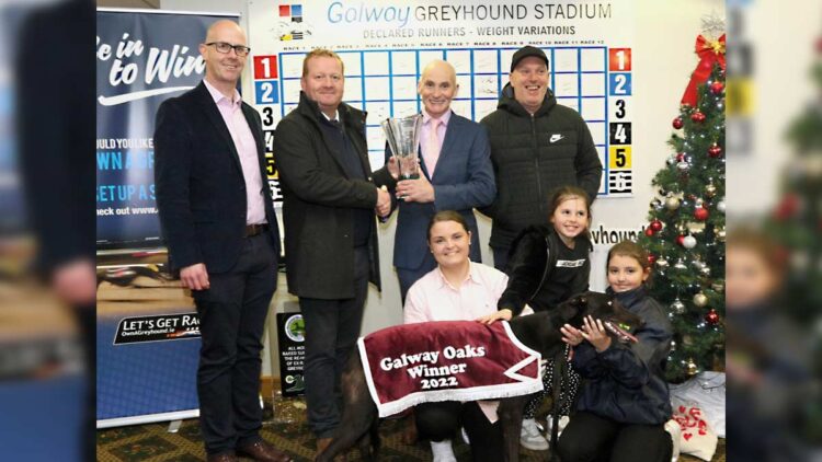 Derek Frehill, Director of Racing, Greyhound Racing Ireland, presents the winning trophy to Stephen Molloy, Oughterard, after Raha Mofo won The 2022 GRI Galway Oaks Final, at The Galway Greyhound Stadium. Also in photo are Oliver Hester, Racing Manager, Galway Greyhound Stadium, Murt Leahy, Trainer, Marissa Molloy, owner, with Féile and Ellie May Molloy.