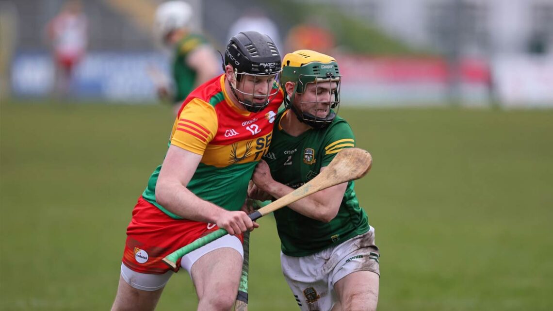Carlow's John Doyle with Meath's Killiane Swaine. Photo: Pat Ahern/Carlow GAA