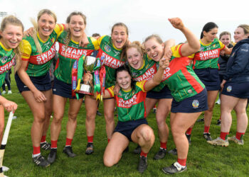 Carlow players celebrate with the trophy 8/4/2023