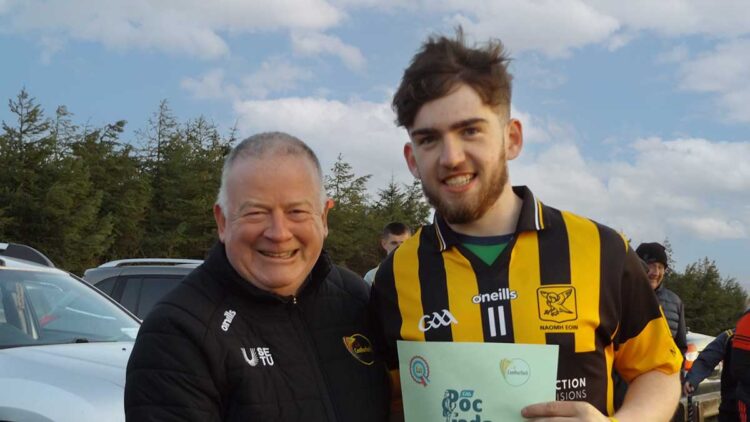 Carlow GAA chairperson Jim Bolger with Naomh Eoin's Dean Slye. Photo: Tommy Murphy